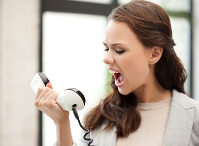 angry businesswoman shouting at phone