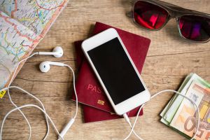 Wooden table with things for travel
